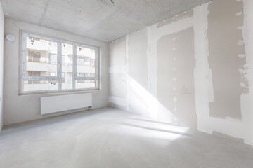 interior of the apartment without decoration in gray colors. rough finish