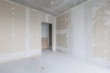 interior of the apartment without decoration in gray colors. rough finish