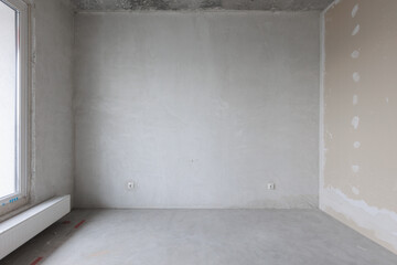 interior of the apartment without decoration in gray colors. rough finish
