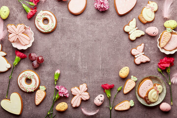 Easter spring background with copy space, decorated cookies, aster flowers. Spring background.