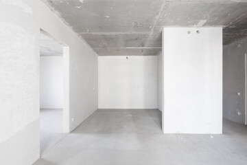 Fototapeta premium interior of the apartment without decoration in gray colors. rough finish