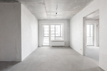 Fototapeta premium interior of the apartment without decoration in gray colors. rough finish