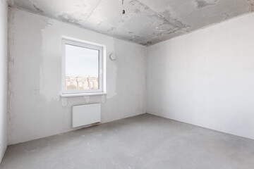 interior of the apartment without decoration in gray colors. rough finish