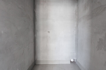 interior of the apartment without decoration in gray colors. rough finish