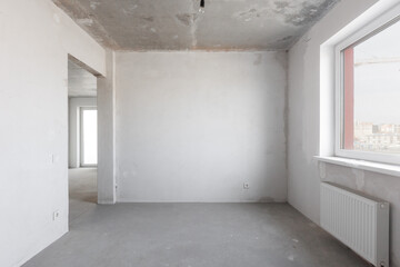 interior of the apartment without decoration in gray colors. rough finish
