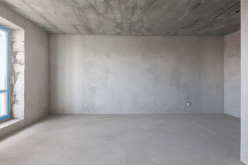 interior of the apartment without decoration in gray colors. rough finish