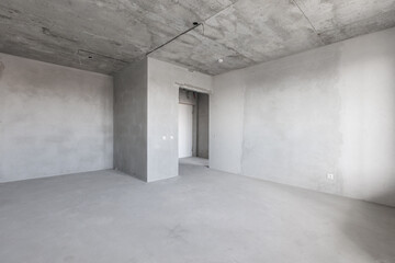 interior of the apartment without decoration in gray colors. rough finish