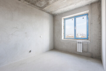 interior of the apartment without decoration in gray colors. rough finish