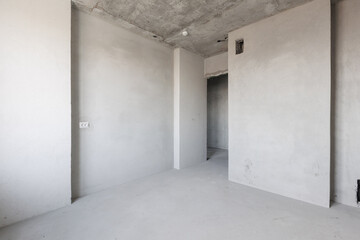 interior of the apartment without decoration in gray colors. rough finish