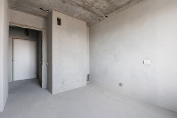 interior of the apartment without decoration in gray colors. rough finish