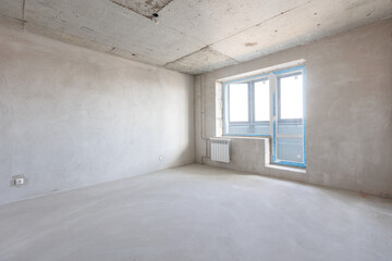 interior of the apartment without decoration in gray colors. rough finish