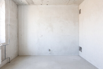 interior of the apartment without decoration in gray colors. rough finish