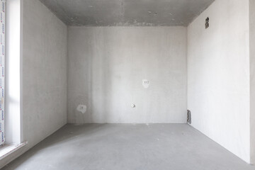 interior of the apartment without decoration in gray colors. rough finish