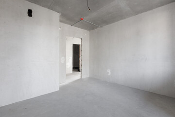 interior of the apartment without decoration in gray colors. rough finish