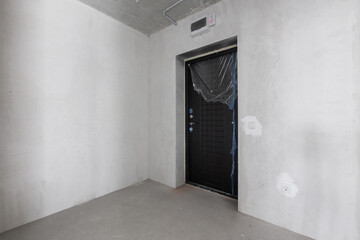 interior of the apartment without decoration in gray colors. rough finish
