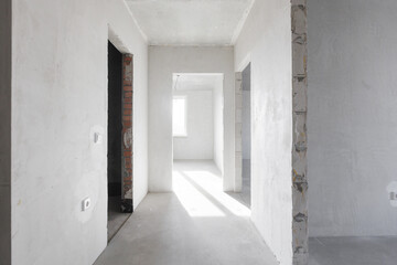 Fototapeta premium interior of the apartment without decoration in gray colors. rough finish