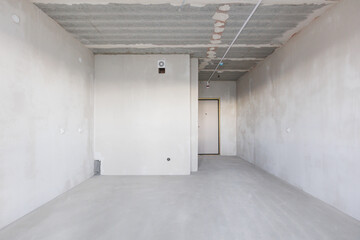 interior of the apartment without decoration in gray colors. rough finish