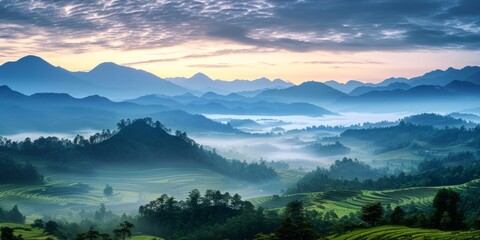 Misty mountainous landscape at sunrise