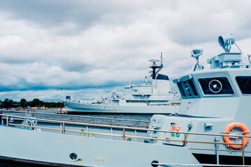 Naklejka premium Disused war frigates on display at a tourist harbor in Copenhagen.