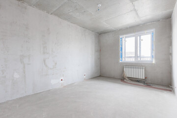 interior of the apartment without decoration in gray colors. rough finish