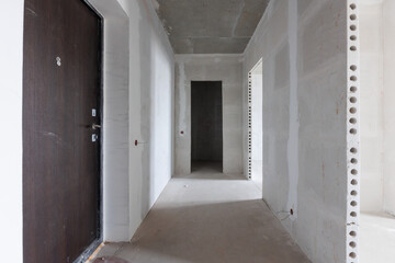 interior of the apartment without decoration in gray colors. rough finish