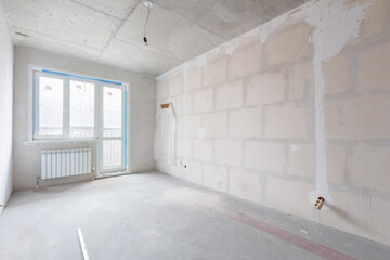 interior of the apartment without decoration in gray colors. rough finish