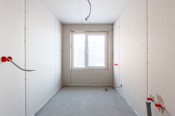 interior of the apartment without decoration in gray colors. rough finish