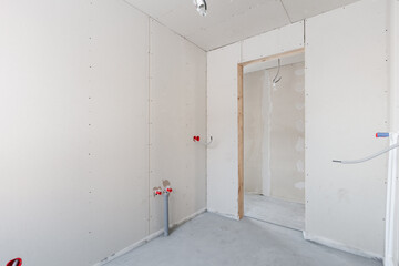 interior of the apartment without decoration in gray colors. rough finish