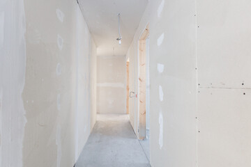 interior of the apartment without decoration in gray colors. rough finish