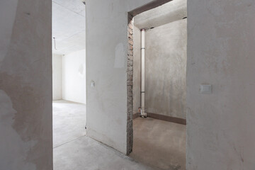 interior of the apartment without decoration in gray colors. rough finish