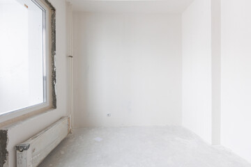 interior of the apartment without decoration in gray colors. rough finish