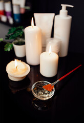 Stylish still life on black glossy table of beautician.