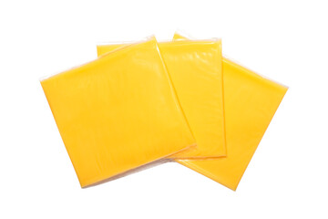 Processed cheese for making hamburgers and cheeseburgers, wrapped in transparent plastic packaging, highlighted on a white background.Cheese in a transparent package.