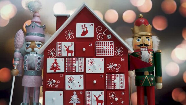 Wooden Tree Advent Calendar Decorated and Nutcracker Soldier Toys With Bokeh Blured Background. Uhd 4K Dolly Shot