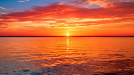 Naklejka na ściany i meble Tranquil ocean sunrise casting a warm glow over the water