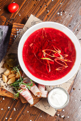 cold borscht with pieces of bacon, garlic and , dark and moody, top new