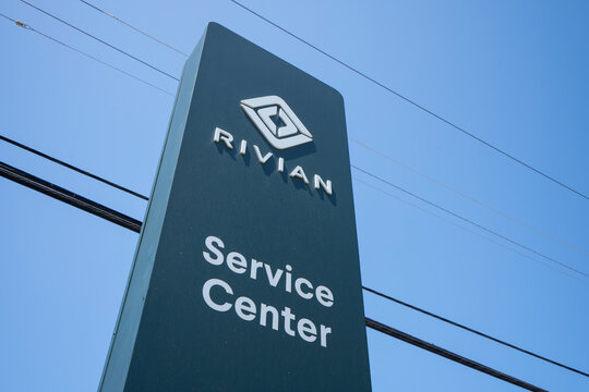 South San Francisco, CA, USA - May 1, 2022: Rivian sign is seen at its service center in South San Francisco, California. Rivian Automotive, Inc., is an American electric vehicle manufacturer.