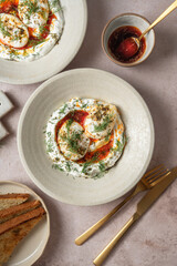 Turkish poached eggs Cilbir with yogurt and brown butter