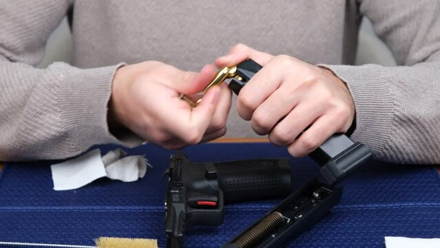 unloading bullets magazine