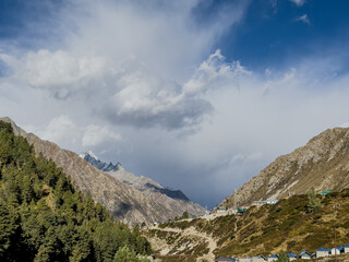 Obraz premium Landscape in high altitude mountains with clouds and blue sky
