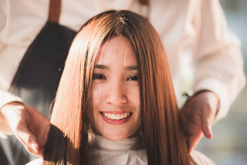 Asian Hairdresser giving treatment and barber occupation service, Professional hairstylist combing...