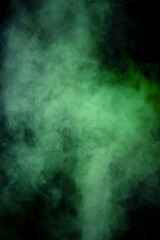 Green and white steam on a black background.