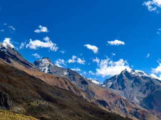 Landscape in the mountains with blue sky and clouds on a bright day