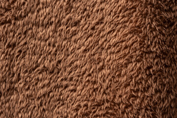 Texture of a brown faux fur as a background.