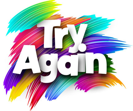 Try again paper word sign with colorful spectrum paint brush strokes over white.