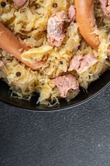 sauerkraut with garnish cabbage, meat, sausage tasty fresh delicious healthy eating cooking appetizer meal food snack on the table copy space food