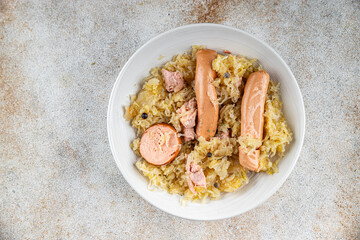 sauerkraut with garnish cabbage, meat, sausage tasty fresh delicious healthy eating cooking appetizer meal food snack on the table copy space food