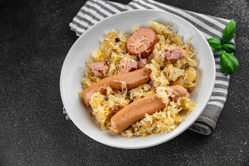 sauerkraut with garnish cabbage, meat, sausage tasty fresh delicious healthy eating cooking appetizer meal food snack on the table copy space food