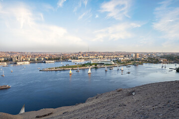 Fototapeta premium Sunset over the Nile River in the city of Aswan with sandy and deserted shores