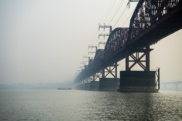 Hardinge Bridge in fog steel railway truss bridge over the Padma River, Bangladesh.